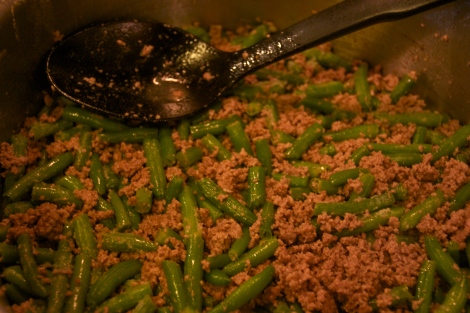 Mixing in the green beans